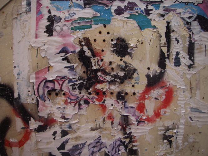 Decollage, graffitti and bullet holes